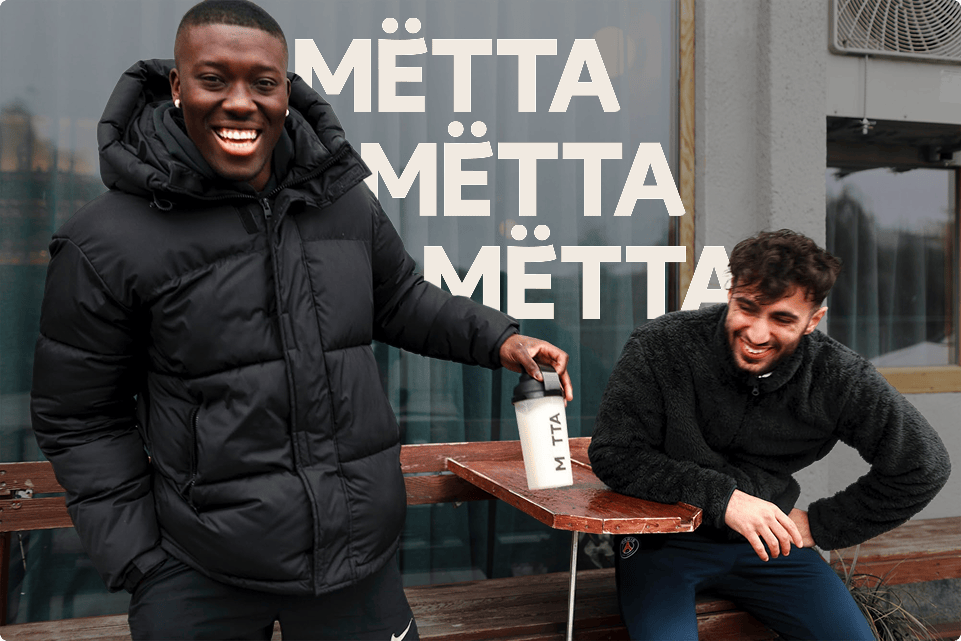Two 20 year old guys hanging outdoors and holding a MËTTA food shake